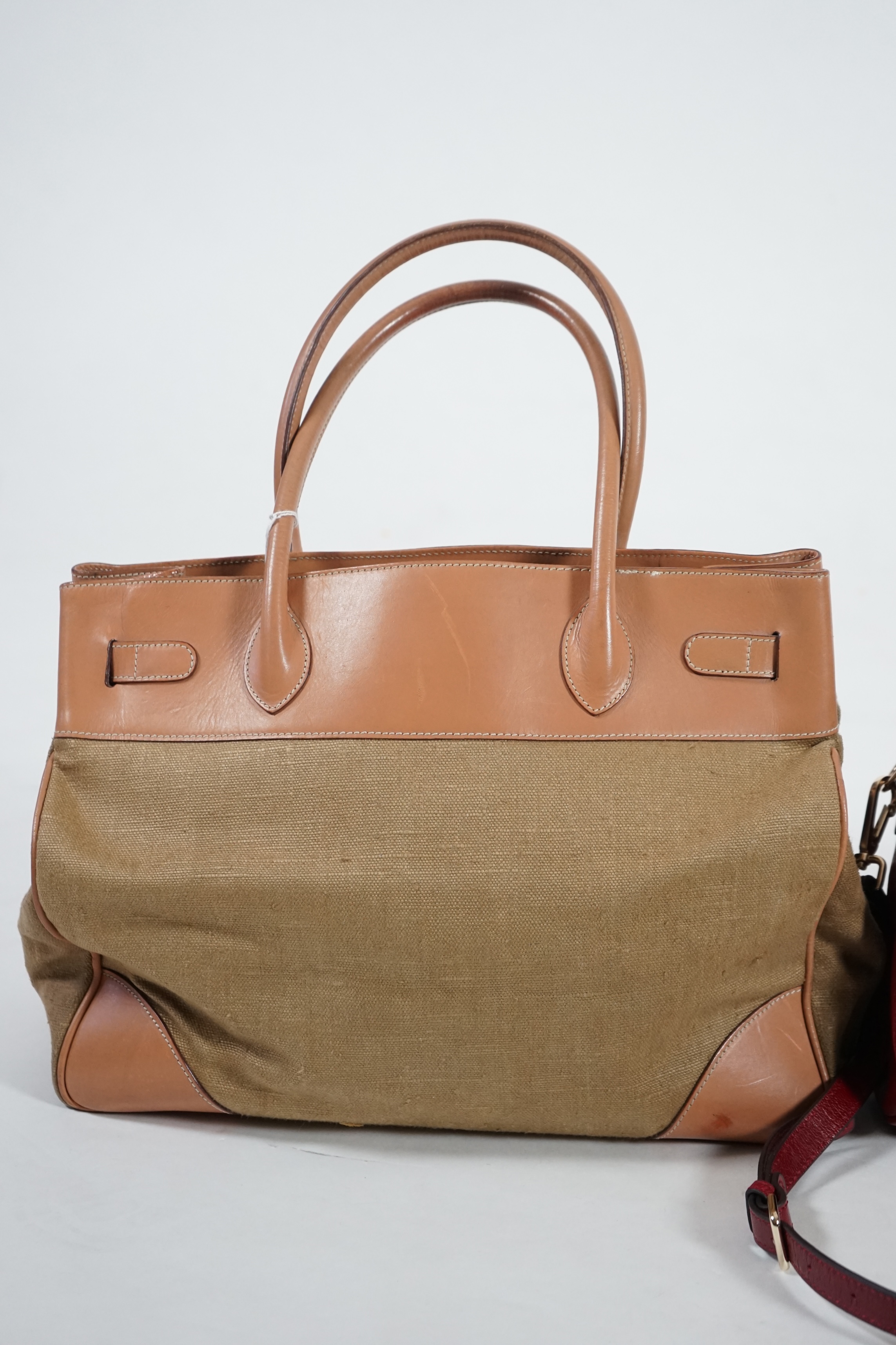Two Maria Carla handbags and a Piertucci light tan canvas and leather bag. Proceeds to Happy Paws Puppy Rescue